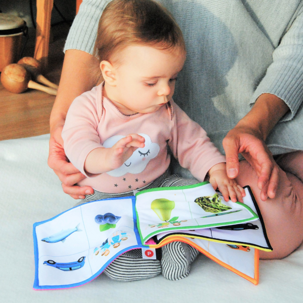 Mom reading book to baby