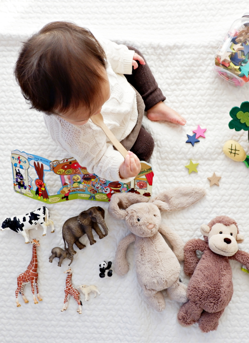 Child playing with toys for save money on baby