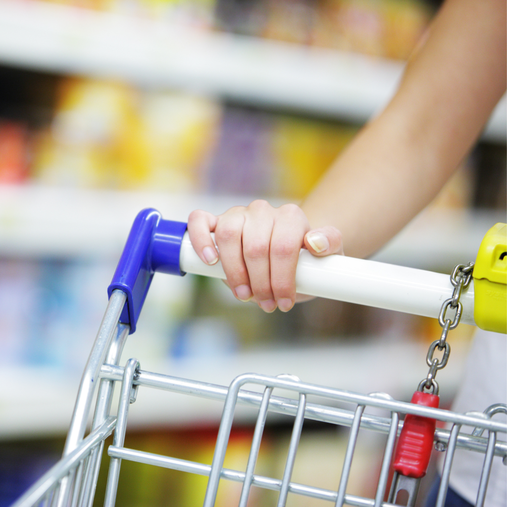 Woman pushing shopping cart for Make Money FAST with These 10 Tricks