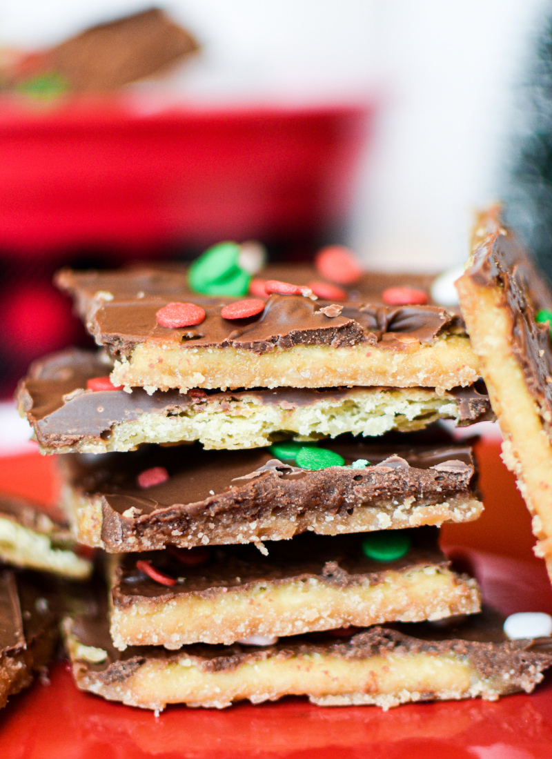Stack of easy Christmas crack recipe on red plate