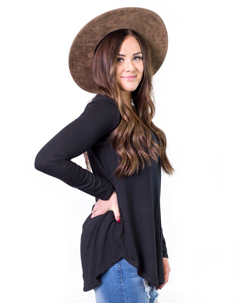 Woman with hat wearing black tee