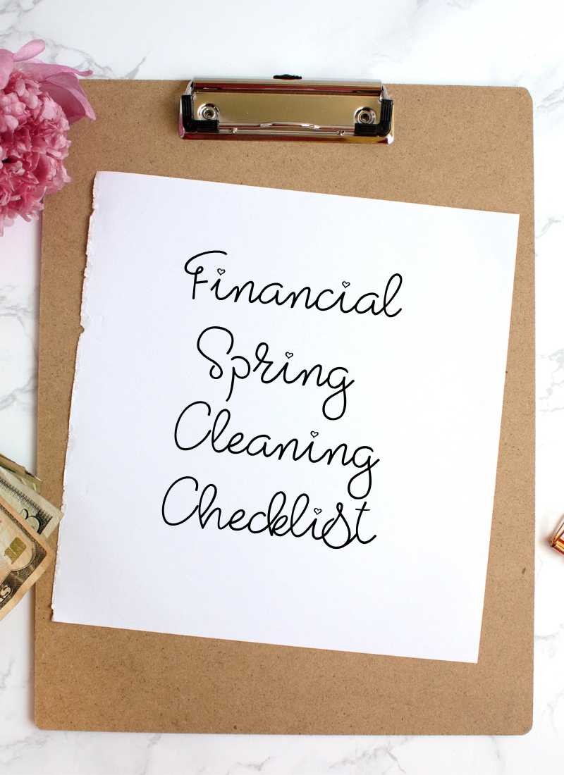 Clipboard with money and peony flower for financial spring cleaning checklist