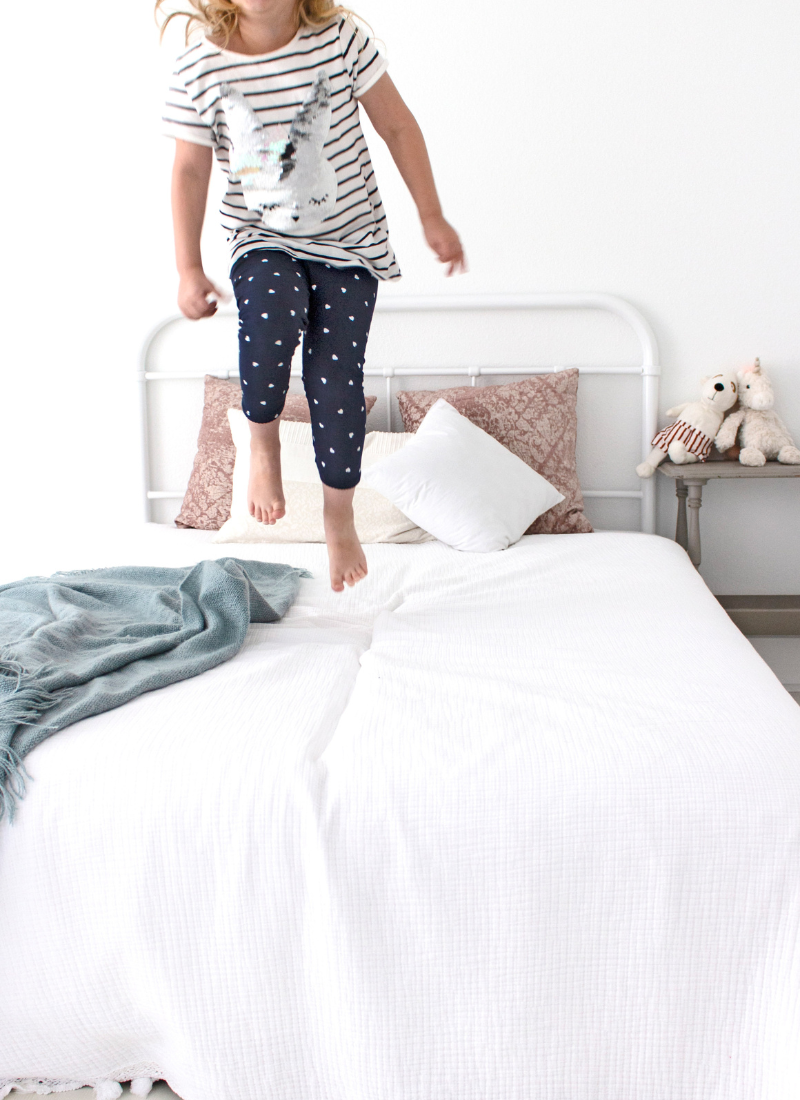 Child jumping on the bed