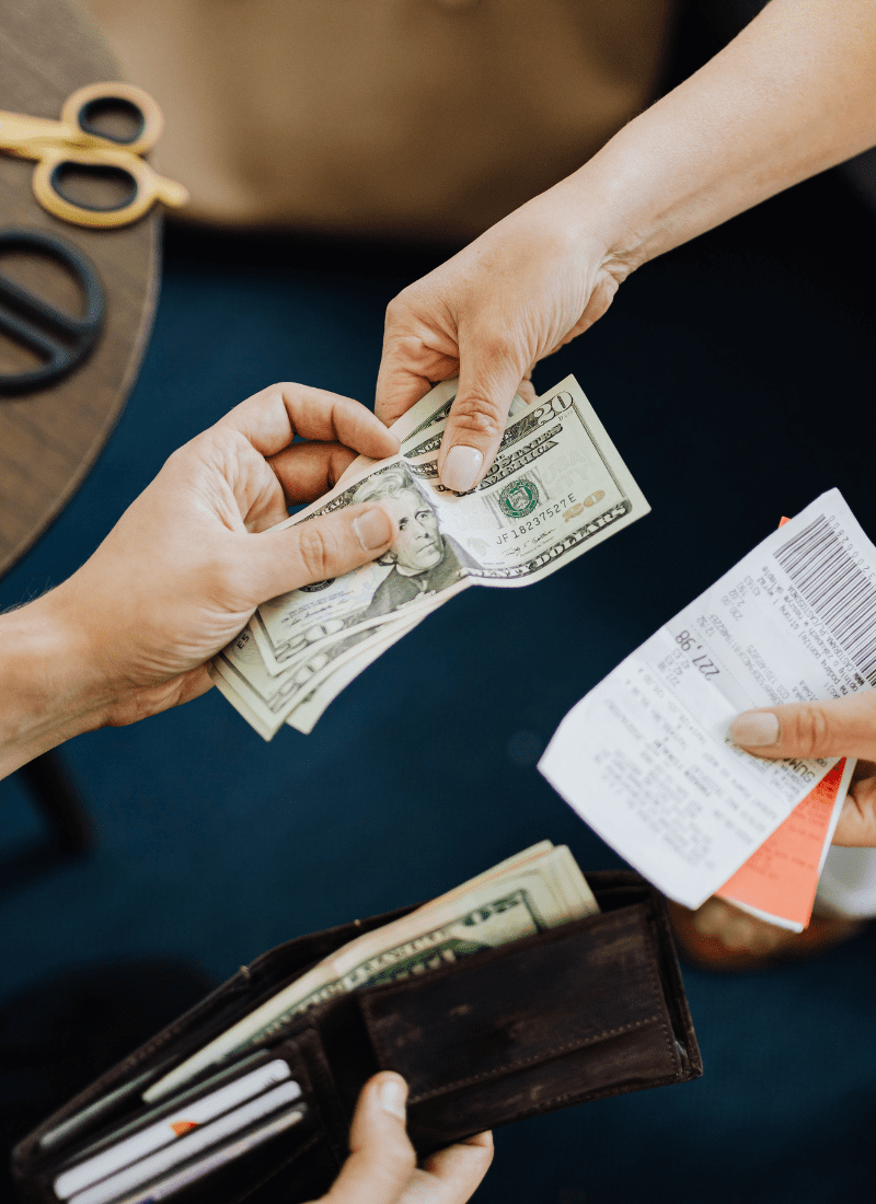 Hands exchanging money for increasing cash flow