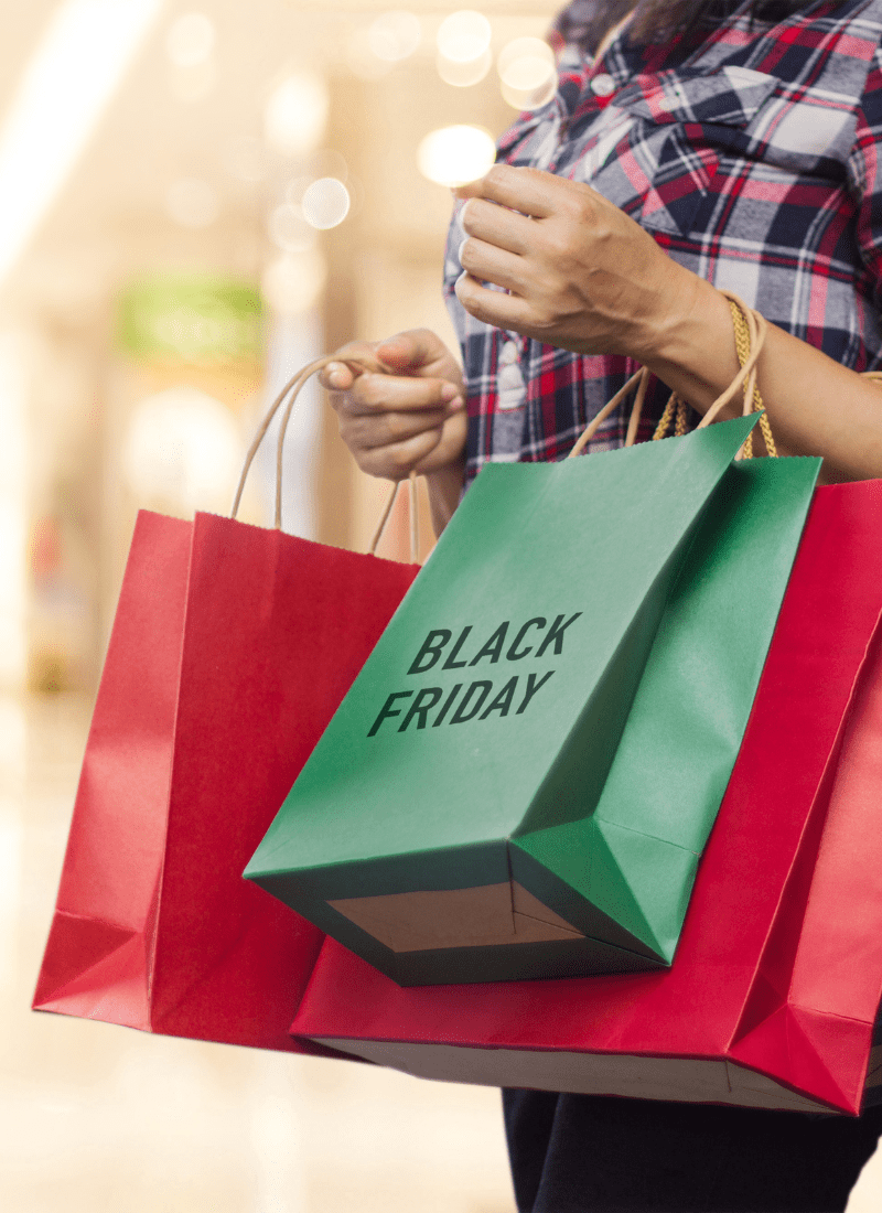 Shopper with shopping bags for Black Friday Tips