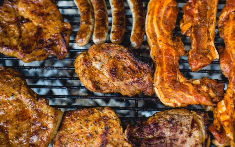 Meat on a grill for Cheap Foods To Buy When You're Broke & Hungry