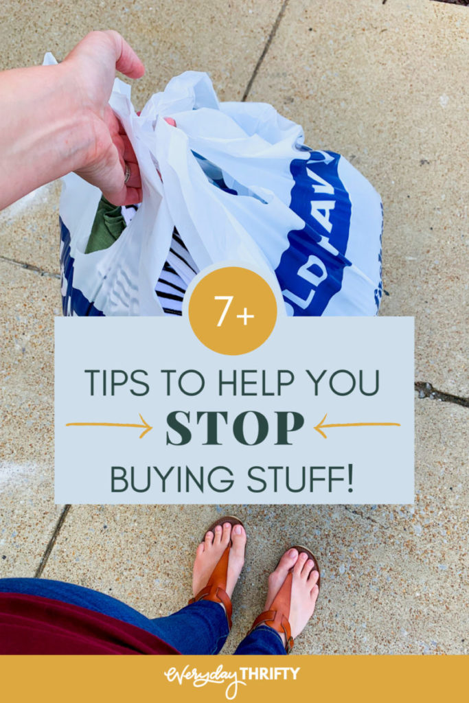 person holding shopping bag for how to stop buying stuff 