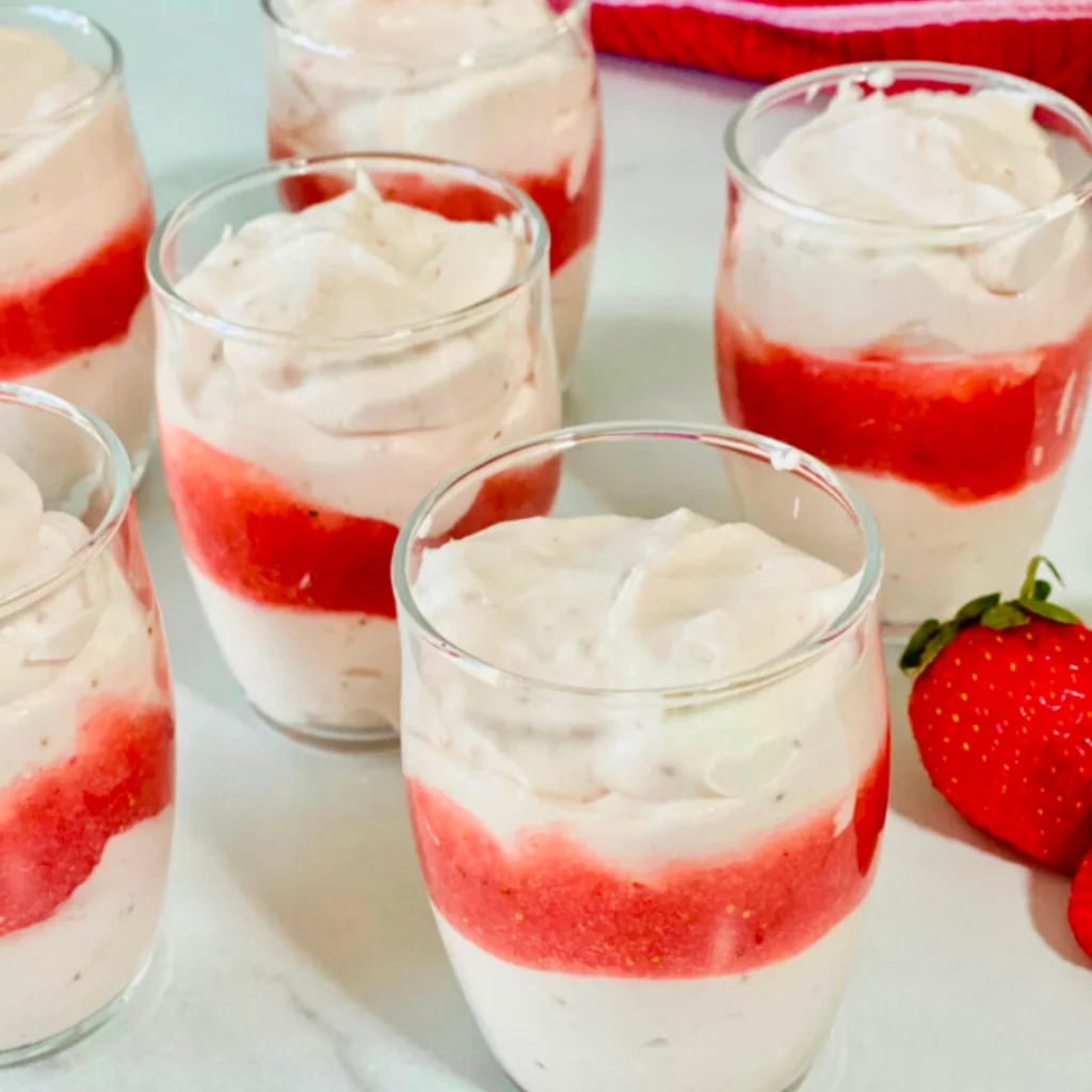 fresh strawberry mousse parfaits in glass cups
