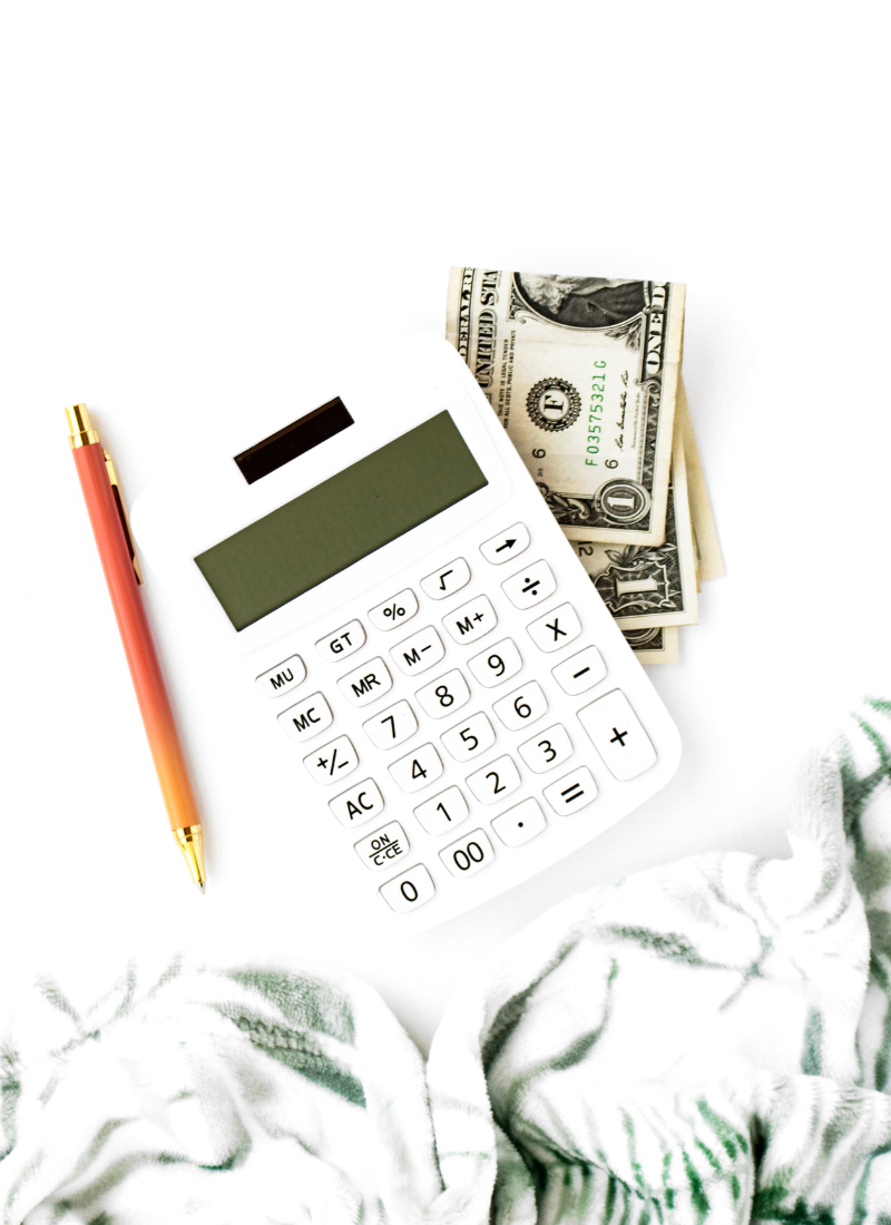 white calculator, pencil, money for how to save 5000 in 3 months