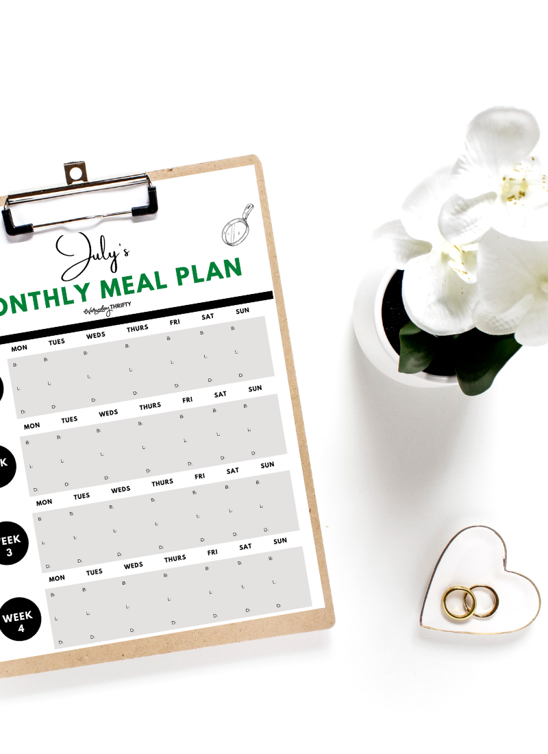 Printable meal plan on clipboard for monthly meal plan on a budget