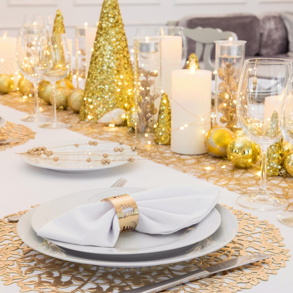 White and gold tabletop decor can be an affordable way to plan a Christmas party on a budget. 
