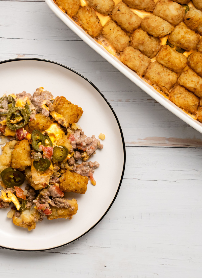 Plate and casserole dish with jalapeno tater tot casserole recipe