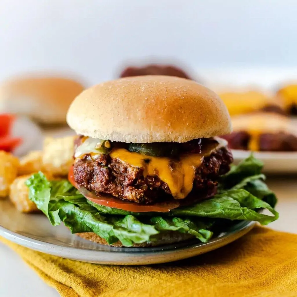 Homemade cheese burger on a plate for wedding rehearsal dinner ideas on a budget