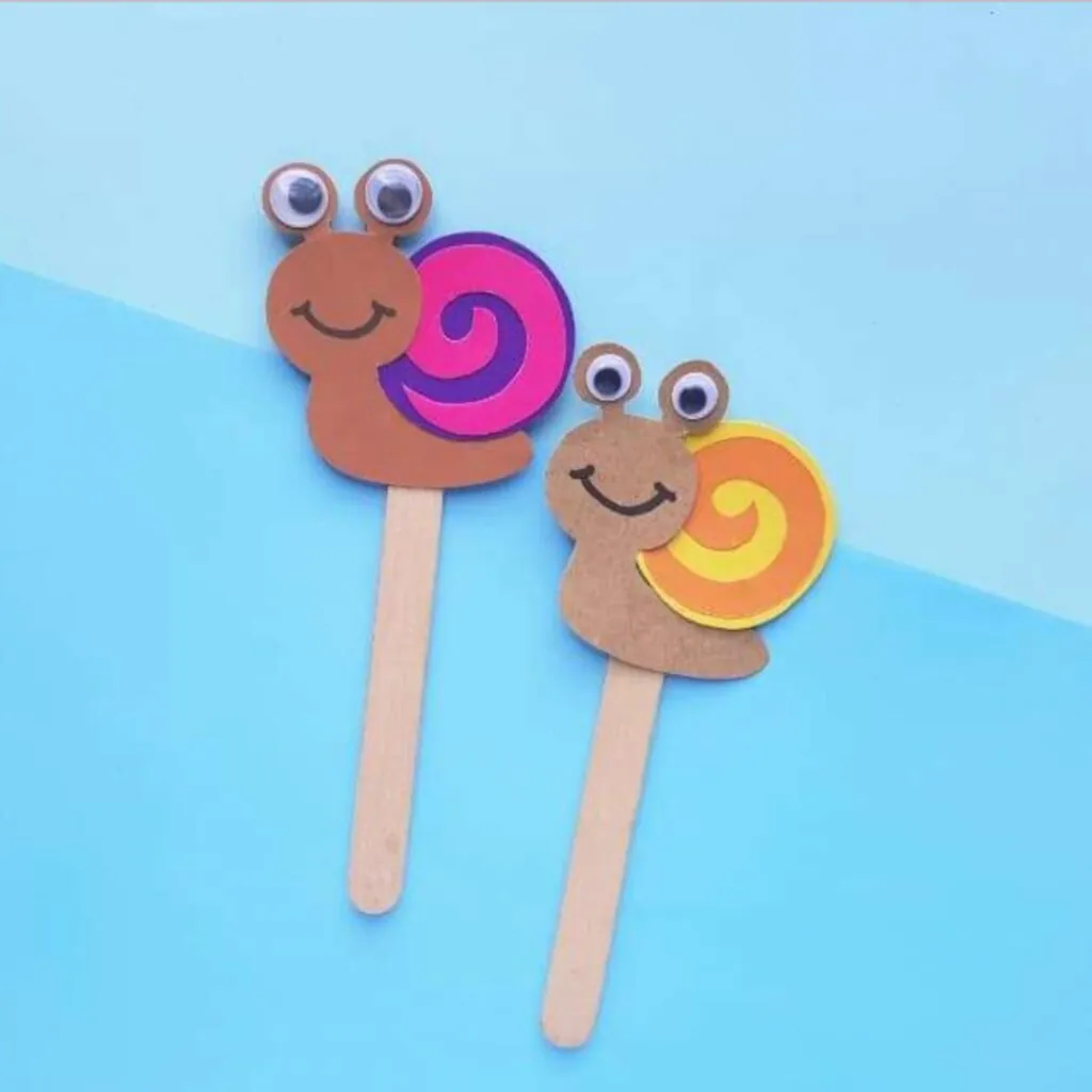 Paper snail crafts on popsicle sticks 