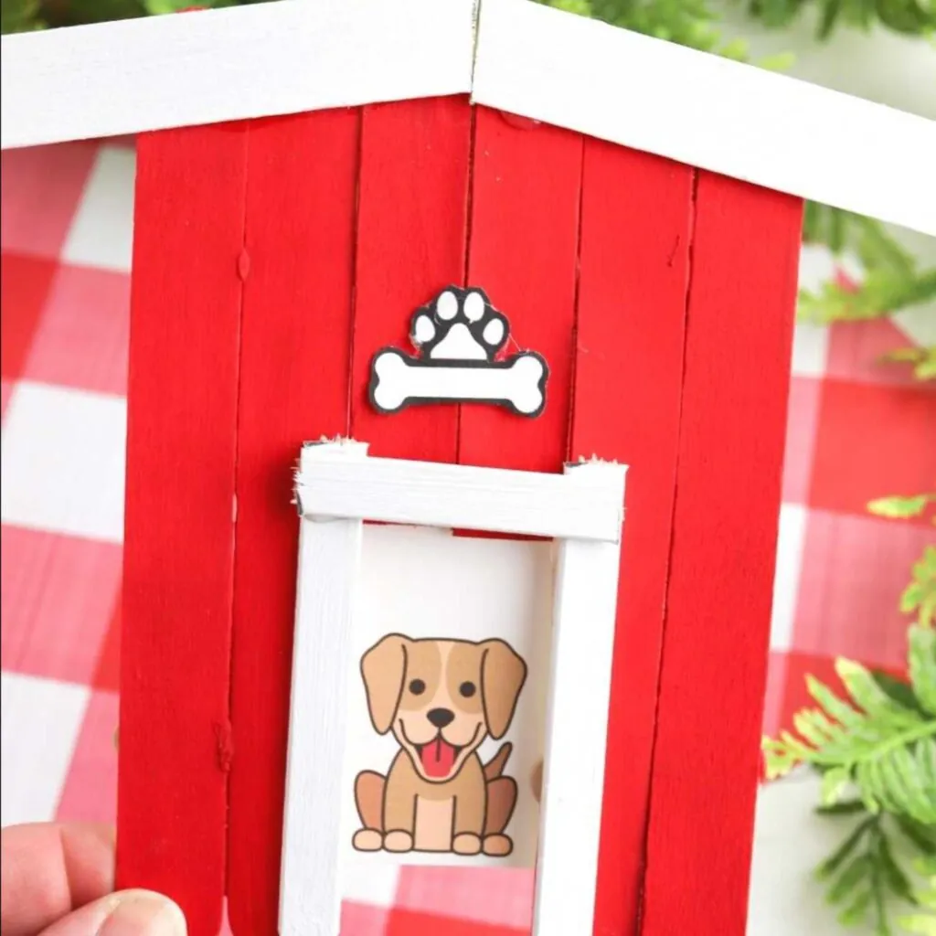 Red dog house made out of popsicles for dollar store craft ideas